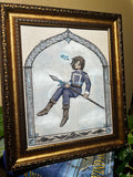 Framed artwork of a character holding a spear with a decorative gold frame.