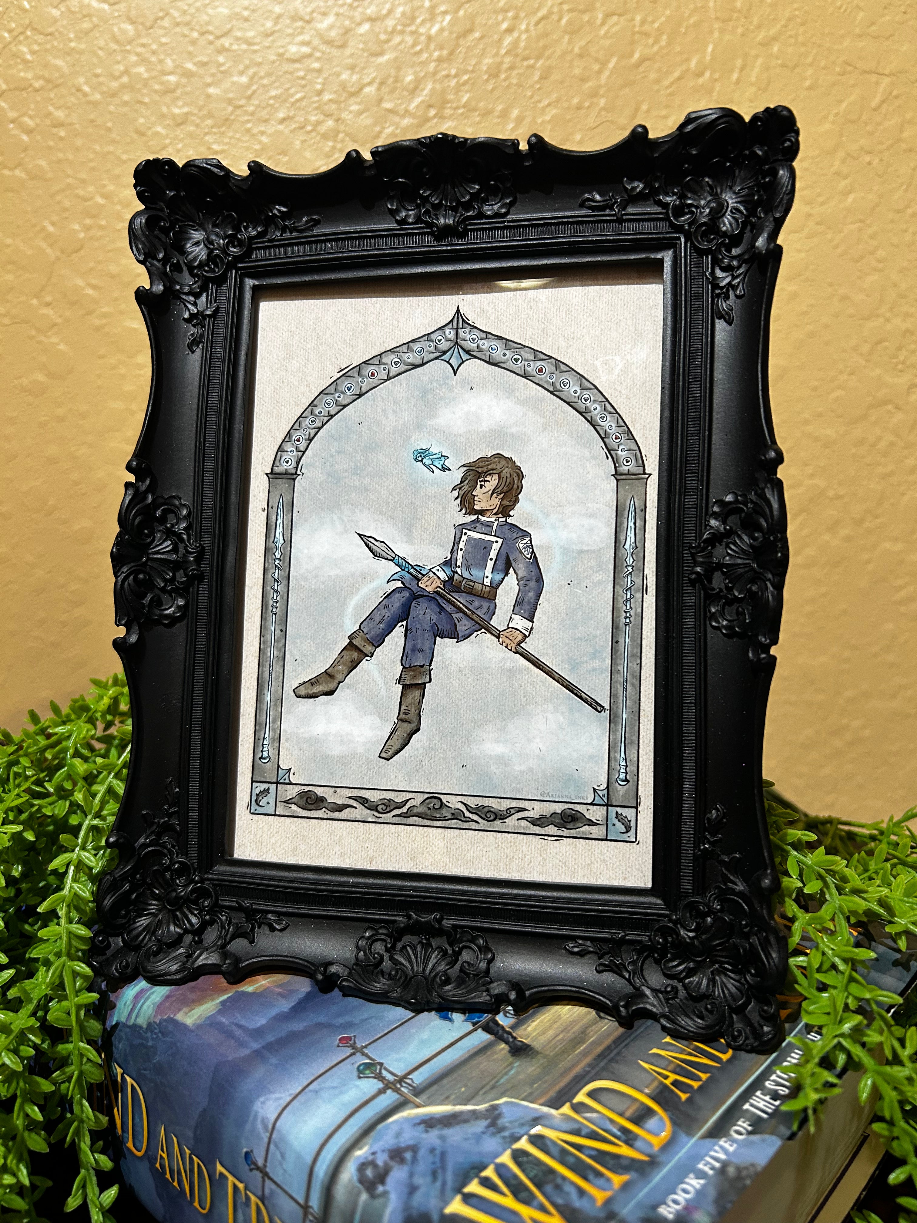 Framed photo of print of character with a spear